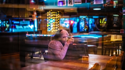 Woman sitting on a table in the room
